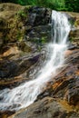 Beautiful Andahelena Ella waterfall in Elpitiya, Sri Lanka. Water stream cascaded through wet mossy rocks, surrounded by lush Royalty Free Stock Photo