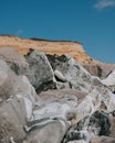 Beautiful angle shot of multiple peaky and ridged stones with the background of a high hill