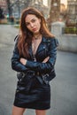 Beautiful, angry girl standing in the street