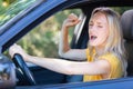 beautiful angry woman honking in car Royalty Free Stock Photo