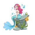 Beautiful anime mermaid with curly pink hair and shiny blue fish tail sitting on sea rock with seaweed Royalty Free Stock Photo