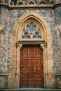 Beautiful antique door to the Catholic Cathedral. Entrance to the church. Exterior of a religious building. Royalty Free Stock Photo