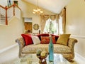 Beautiful antique sofa with colorful pillows. House inteior.