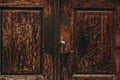 Beautiful antique wooden doors in Italy with metal handles