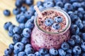 Beautiful appetizer blueberry fruit smoothie milk shake glass jar with juicy fresh berries background top view Yogurt cocktail Nat Royalty Free Stock Photo