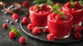 Beautiful appetizer pink raspberries fruit smoothie or milk shake in glass jar with berries Royalty Free Stock Photo