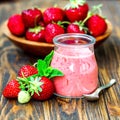 Beautiful appetizer red strawberry fruit smoothie or milk shake in glass jar with berries on wooden background, top view. Royalty Free Stock Photo