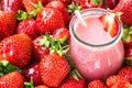 Beautiful appetizer red strawberry fruit smoothie. Yogurt cocktail. Close up. Natural detox. Liquid ice cream. Glass of strawberry Royalty Free Stock Photo