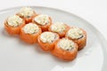 Beautiful appetizing rolls of sushi on a white plate