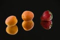 Beautiful apricots combined with ripe red strawberry. Royalty Free Stock Photo