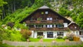 Beautiful Alps landscape with green mountains, valley, houses and forest