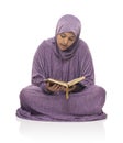 Beautiful Arab Muslim Girl Sitting Reading Holy Book of Quran