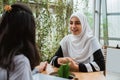 Arab muslim woman talk to friend