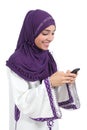 Beautiful arab woman browsing her smart phone