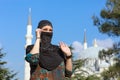 Beautiful Arabian Woman in traditional Muslim Clothing talking on Telephone Royalty Free Stock Photo