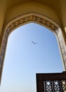 Beautiful arch full of mosaics in contrast with blue sky.