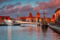 Beautiful architecture of Gdansk old town reflected in the Motlawa river at sunrise, Poland Royalty Free Stock Photo