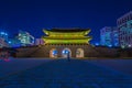 Beautiful Architecture in Gyeongbokgung Palace at Seoul city Korea at Twilight time with night light from traffic car Royalty Free Stock Photo