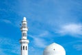 Beautiful architecture, minaret and dome of Tengku Tengah Zaharah Mosque with blue sky background,iconic floating mosque located Royalty Free Stock Photo