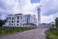 Beautiful architecture Model Mosque in Bangladesh with a White cloudy Blue sky Royalty Free Stock Photo