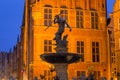 Beautiful architecture of the old town in Gdansk with Neptune fountain at dawn, Poland Royalty Free Stock Photo