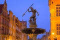 Beautiful architecture of the old town in Gdansk with Neptune fountain at dawn, Poland Royalty Free Stock Photo