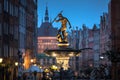 Beautiful architecture of the old town in Gdansk with Neptune fountain at dawn, Poland Royalty Free Stock Photo