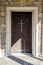 Old wooden church door with cross Batkun monastery Royalty Free Stock Photo