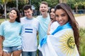 Beautiful argentinian sports fan with other supporters from Argentina