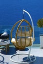 Beautiful armchairs in bamboo cane to relax with the Caldera view in Santorini Royalty Free Stock Photo