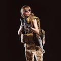 Beautiful army girl with gun isolated on the black background Royalty Free Stock Photo