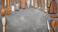 Assorted Kitchen Utensils and Tools on a Gray Surface for Cooking and Baking Needs Royalty Free Stock Photo
