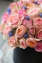 Beautiful arrangement of light pink roses with grape hyacinth in the flowers shop. Royalty Free Stock Photo