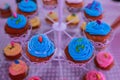 Beautiful arrangements of colorful cup cakes on baptism day Royalty Free Stock Photo