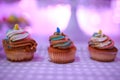 Beautiful arrangements of colorful cup cakes on a table on a baptism day Royalty Free Stock Photo