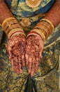 beautiful henna mehandi art in hand full of bangles Royalty Free Stock Photo