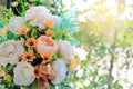 Beautiful artificial flowers in white ceramic vase decoration in living room near a window glass Royalty Free Stock Photo