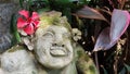 Beautiful artistic Bali stone statue of a Balinese ancient garden statue used as garden decoration, javanese gnome indonesia