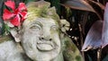 Beautiful artistic Bali stone statue of a Balinese ancient garden statue used as garden decoration, javanese gnome indonesia