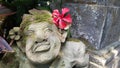Beautiful artistic Bali stone statue of a Balinese ancient garden statue used as garden decoration, javanese gnome indonesia