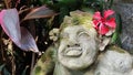 Beautiful artistic Bali stone statue of a Balinese ancient garden statue used as garden decoration, javanese gnome indonesia