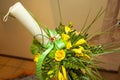 Yellow flower arrangement for baptism candle