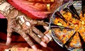 Beautiful artwork drawn on the hand of an Indian bride with herbal heena in wet condition Royalty Free Stock Photo