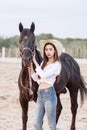 Beautiful Asia girl taking care of her horse with love and caring Royalty Free Stock Photo