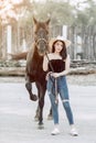 Beautiful Asia girl taking care of her horse with love and caring Royalty Free Stock Photo