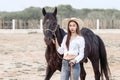 Beautiful Asia girl taking care of her horse with love and caring Royalty Free Stock Photo