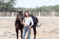 Beautiful Asia girl taking care of her horse with love and caring Royalty Free Stock Photo