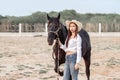 Beautiful Asia girl taking care of her horse with love and caring Royalty Free Stock Photo