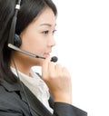 Beautiful asia young business woman with headset Royalty Free Stock Photo