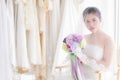 Beautiful Asian bride in wedding dress concept, happy girl hold flowers bouquet dream to her wedding date plan to shopping, woman Royalty Free Stock Photo